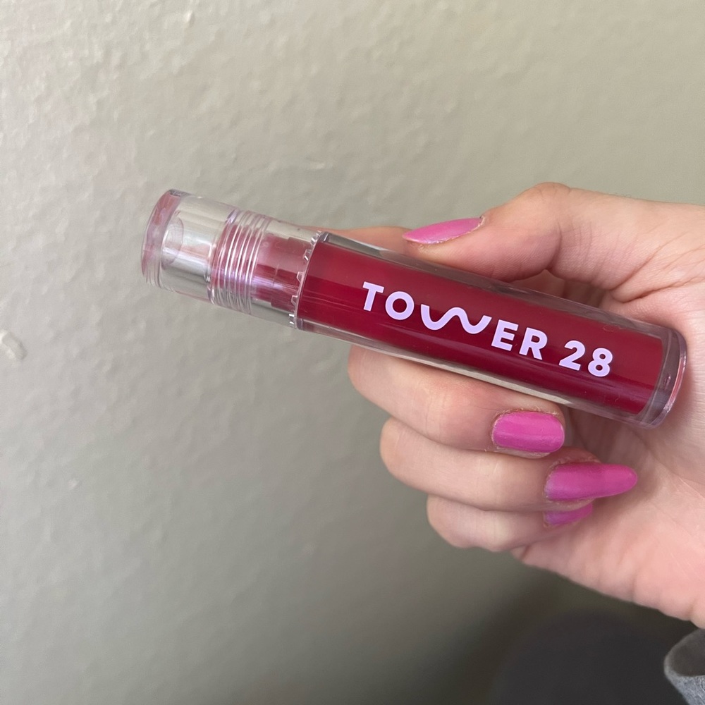 Tower 28 red lip gloss in Wild